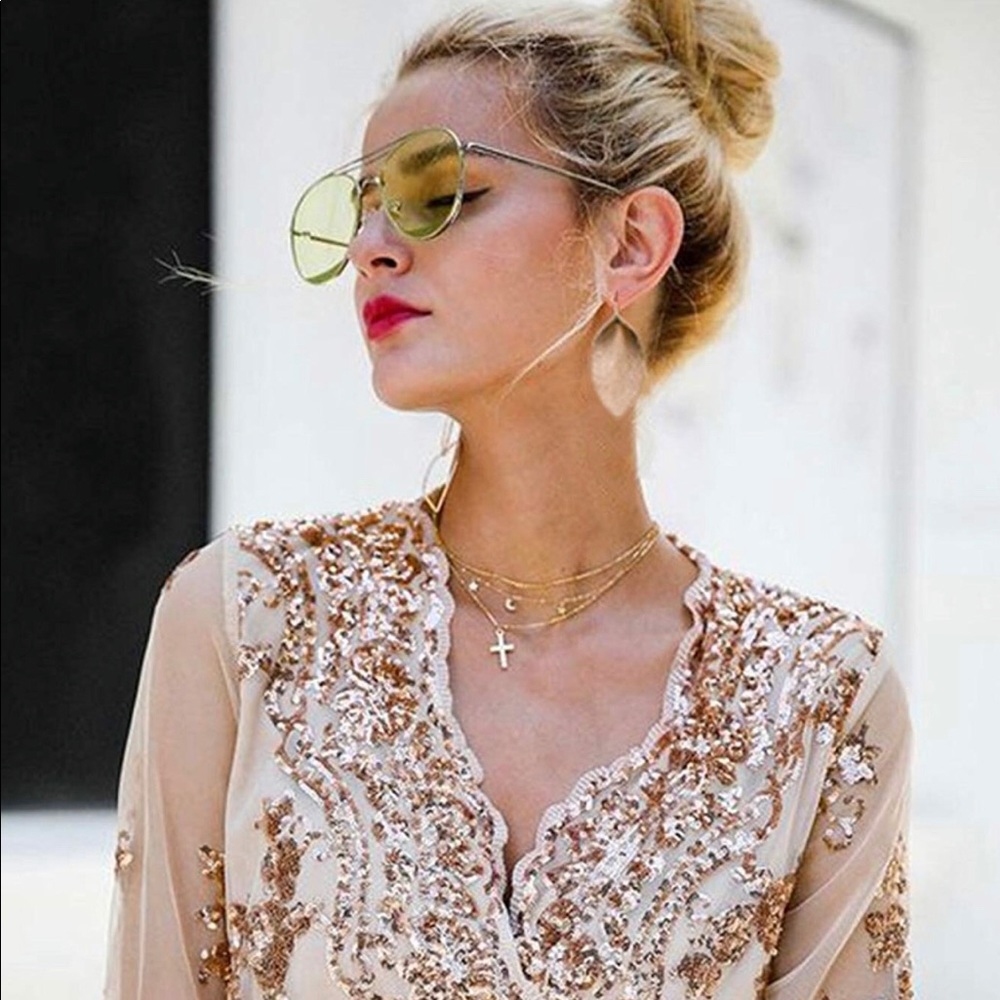 Brand New rose gold leather feather earrings